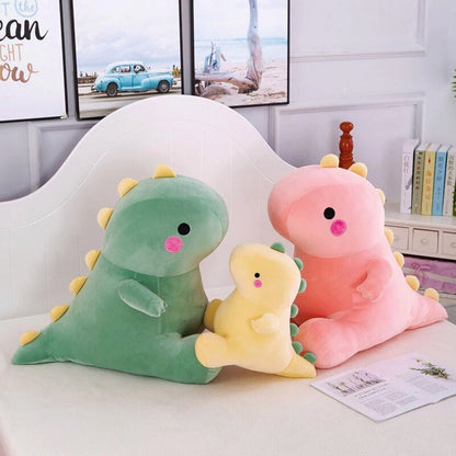 Octoplush Kawaii collection of soft and squishable dinosaur plushies in pastel green, pink, and yellow. This trio of cute dino stuffed animals from Octoplush.store features large and medium sizes with signature yellow spikes and rosy cheeks, perfect for aesthetic room decor and collection sets.