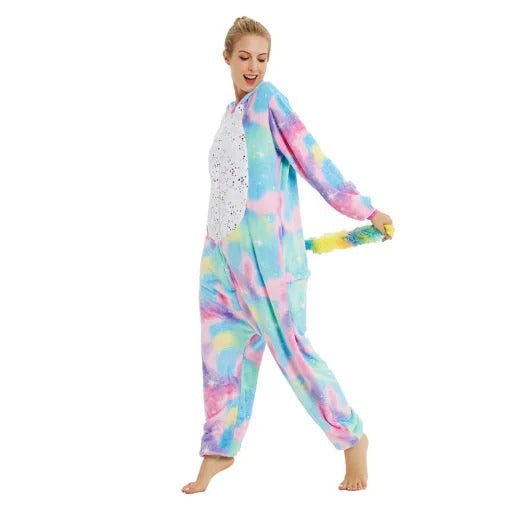 Side pose of adult rainbow unicorn onesie showing colorful fleece and horn hood.